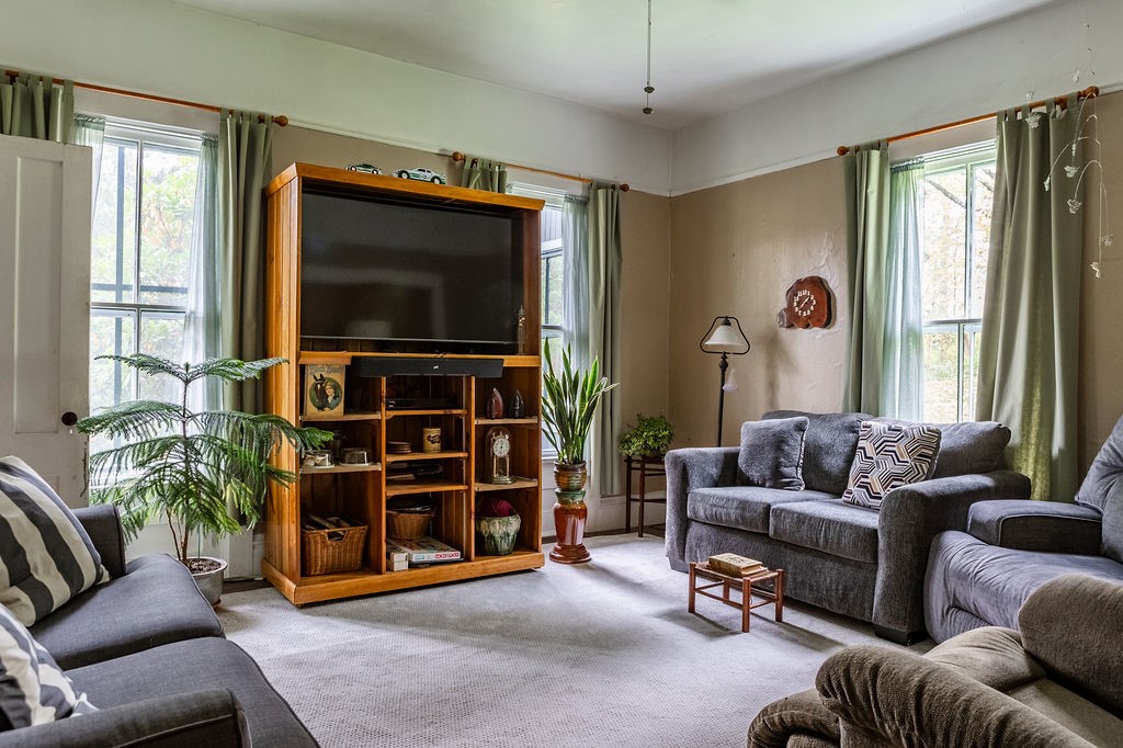 67 Fisk Road Bovina, NY 13753 - Photo 16 of 48 High ceilings and generous windows define this comfortable living area.