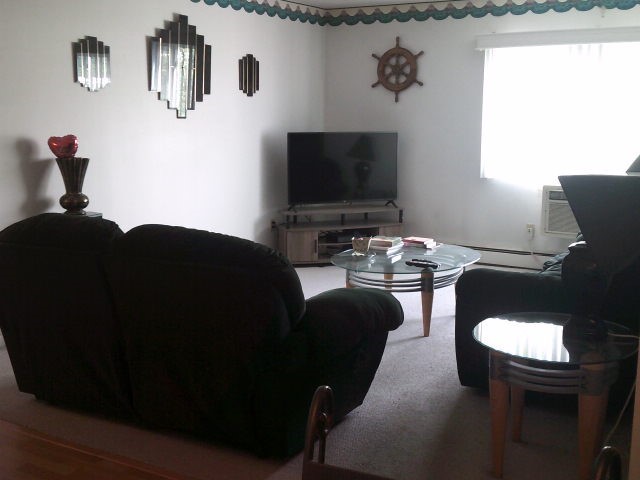 4430 Post Road, Unit 29B Warwick, RI 02818 - Photo 5 of 9 LIGHT FILLED LIVING ROOM