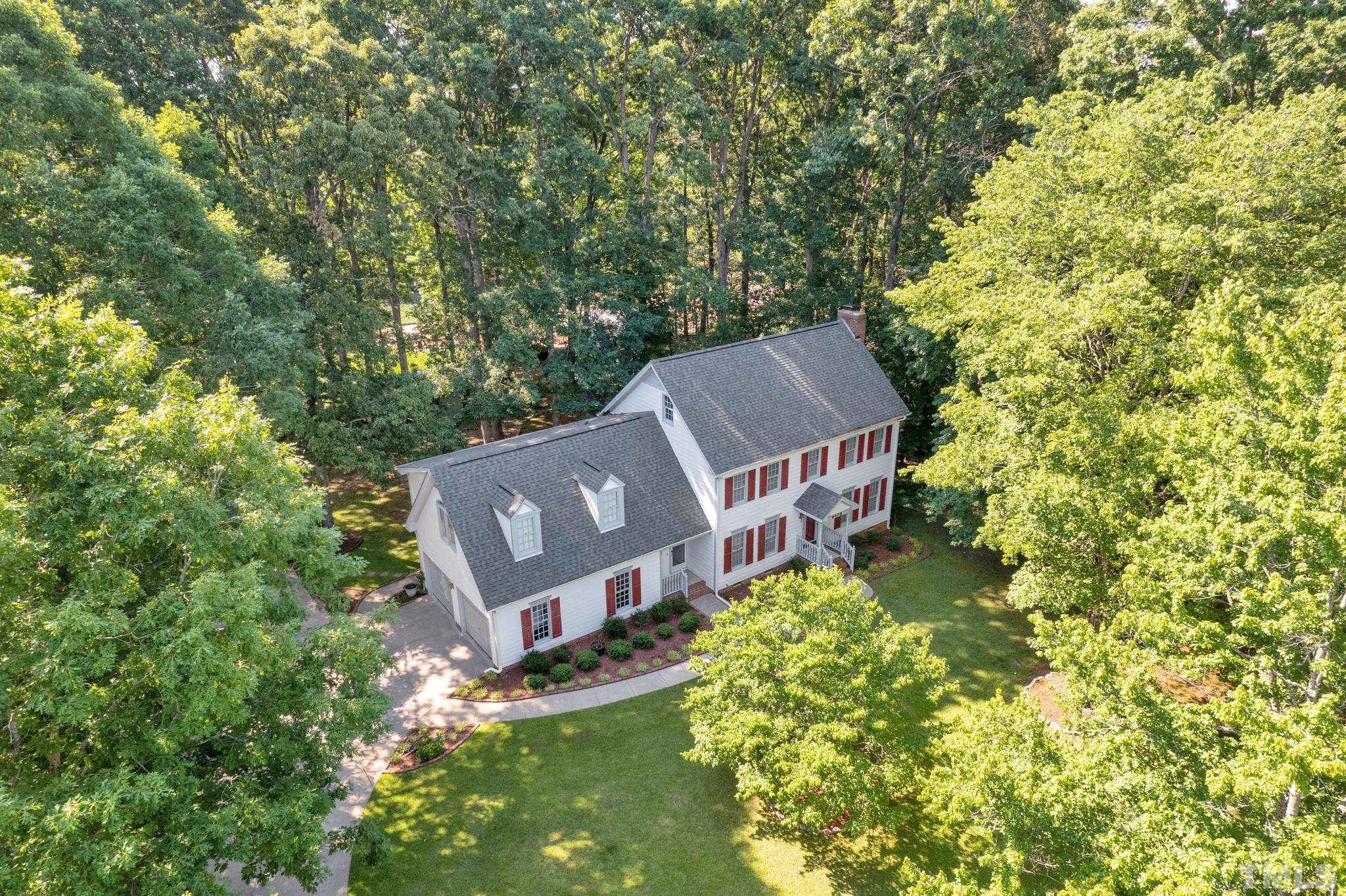 6408 Hampton Ridge Road Raleigh, NC 27603 - Photo 36 of 44 an aerial view of a house with a yard large trees