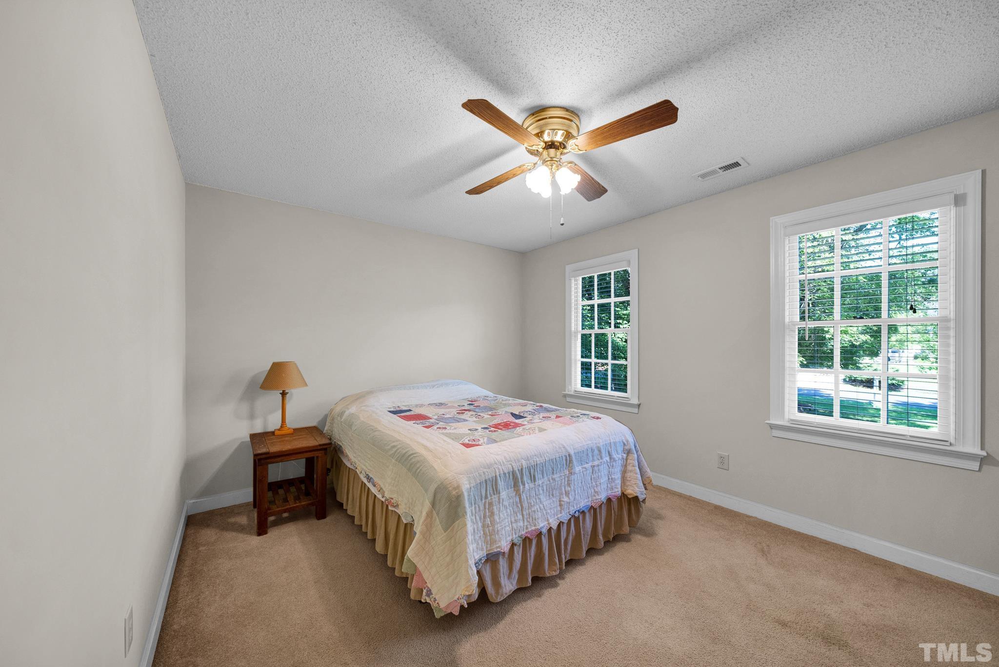 6408 Hampton Ridge Road Raleigh, NC 27603 - Photo 38 of 44 a bedroom with a bed and window