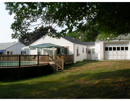 43 Durfee Road Tiverton, RI 02878 - Photo 2 of 6 a front view of a house with a garden