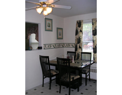 43 Durfee Road Tiverton, RI 02878 - Photo 3 of 6 a view of a dining room with furniture and chandelier