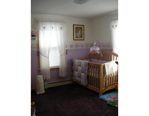 43 Durfee Road Tiverton, RI 02878 - Photo 5 of 6 a bedroom with a bed and a window