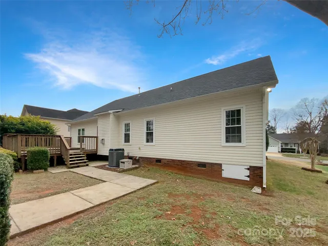 a backyard of a house with yard fire pit and outdoor seating