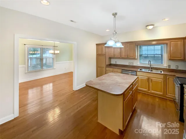 a kitchen with sink cabinets and window