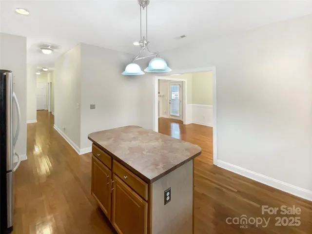 a kitchen with a sink a counter top space and cabinets