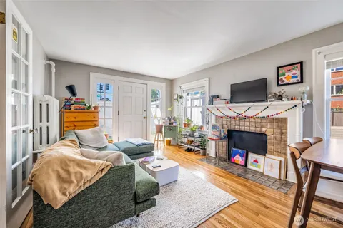 a bedroom with furniture and a fireplace
