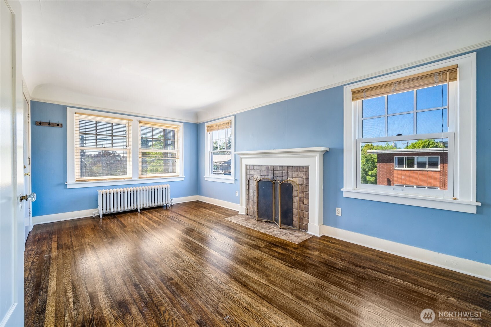 746 10th Avenue East Seattle, WA 98102 - Photo 20 of 34 a view of an empty room with wooden floor and a window