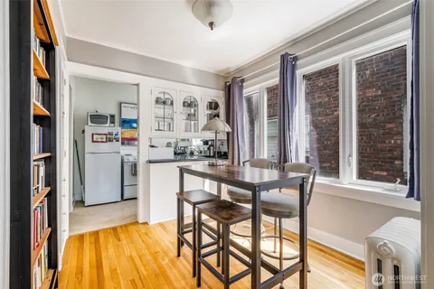 a view of a dining room with furniture and a window