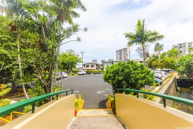 a view of a house with potted plants