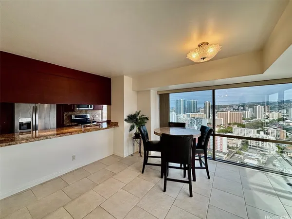 a kitchen with stainless steel appliances kitchen island granite countertop a sink and cabinets