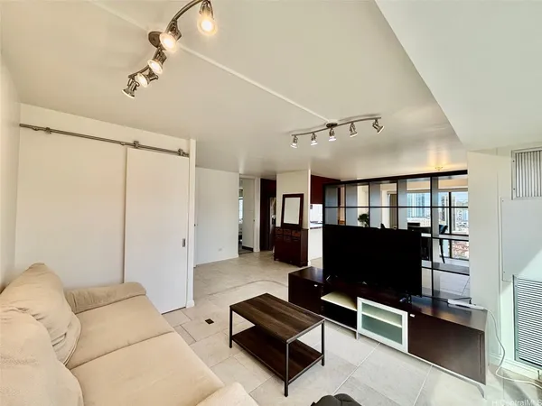 a living room with furniture and a flat screen tv