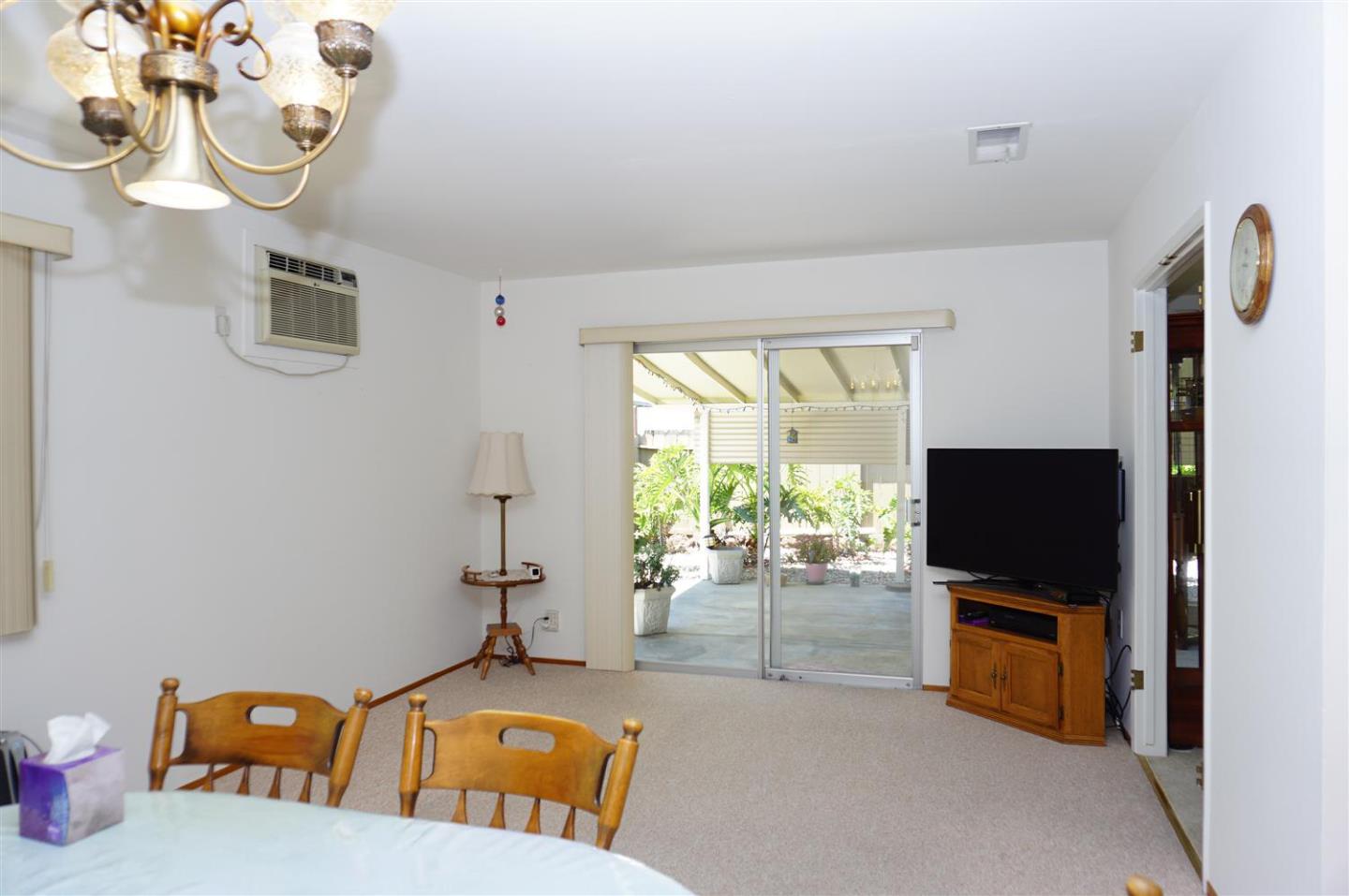 1116 Buchanan Drive Santa Clara, CA 95051 - Photo 16 of 30 a living room with furniture and a flat screen tv