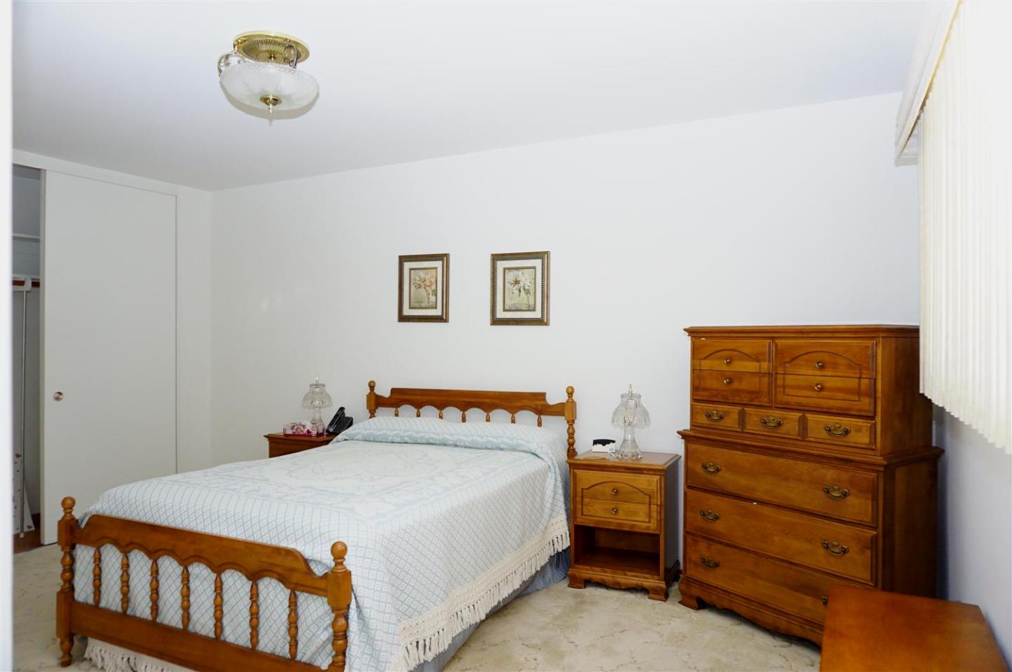 1116 Buchanan Drive Santa Clara, CA 95051 - Photo 20 of 30 a bedroom with a bed and a dresser