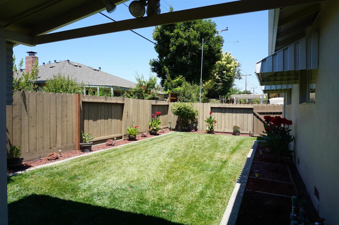 1116 Buchanan Drive Santa Clara, CA 95051 - Photo 26 of 30 a view of backyard with a tub and wooden fence