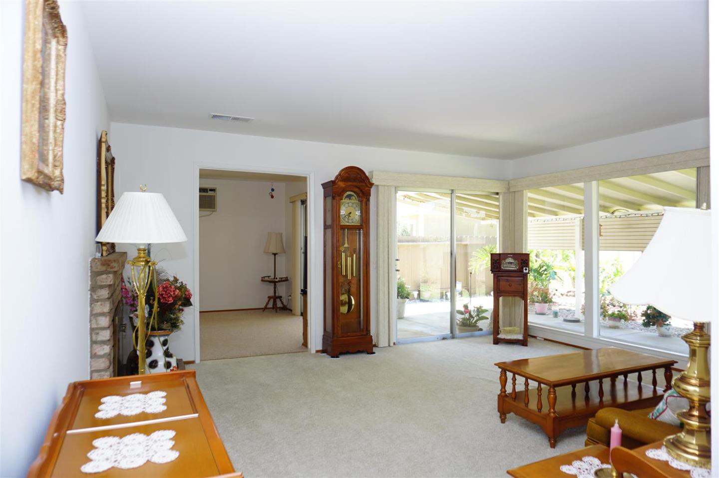 1116 Buchanan Drive Santa Clara, CA 95051 - Photo 5 of 30 a living room with furniture a table and a chandelier