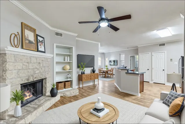 a living room with furniture and a fireplace