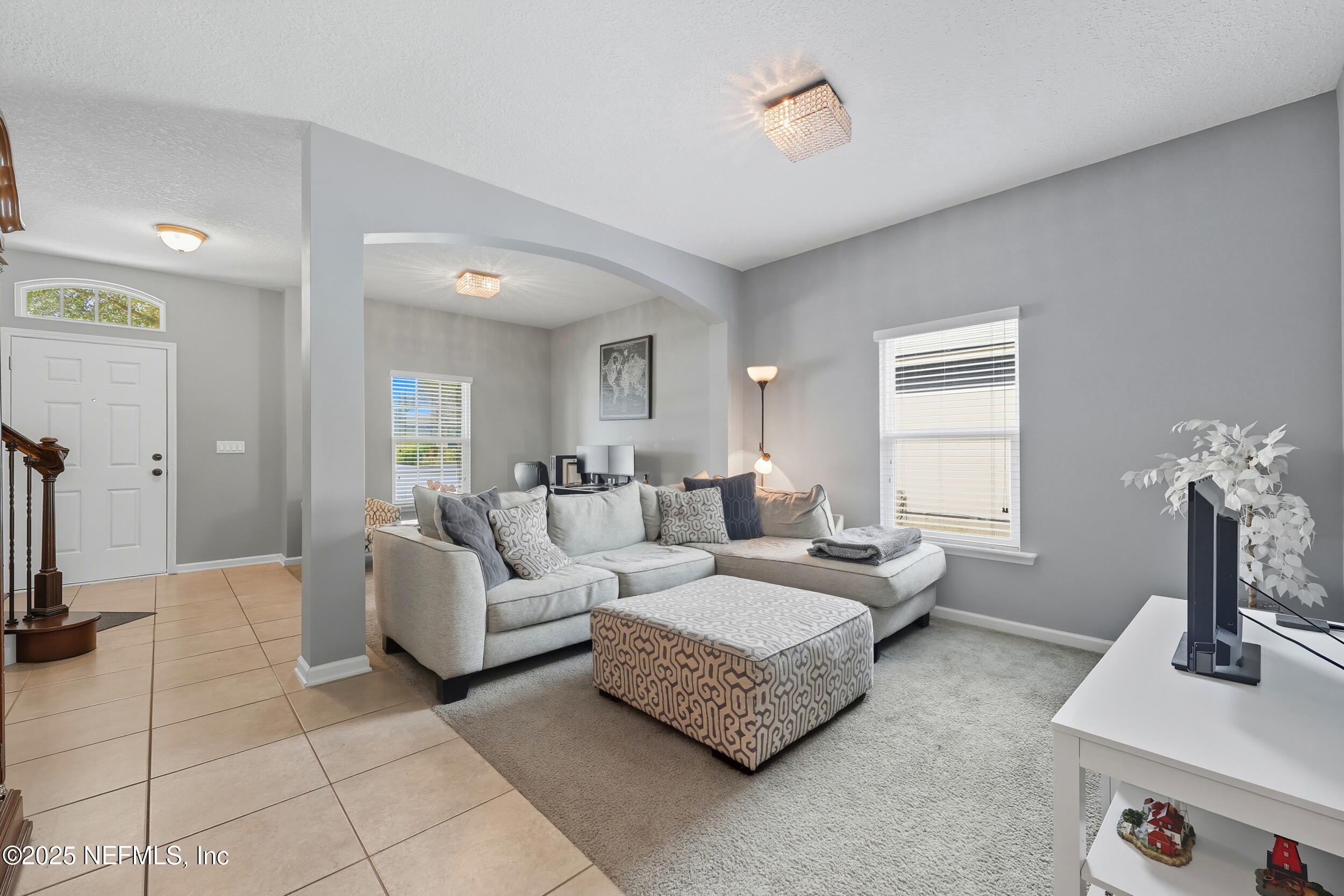 1218 Wetland Ridge Circle Middleburg, FL 32068 - Photo 11 of 75 a living room with furniture and a flat screen tv