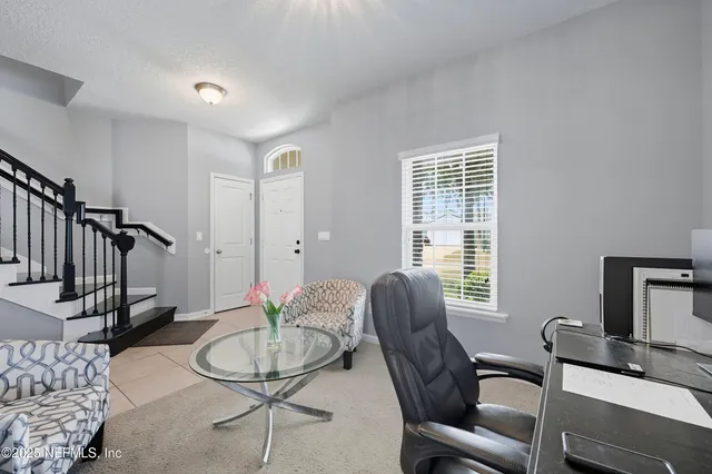 a kitchen with kitchen island a counter space dining table and stainless steel appliances