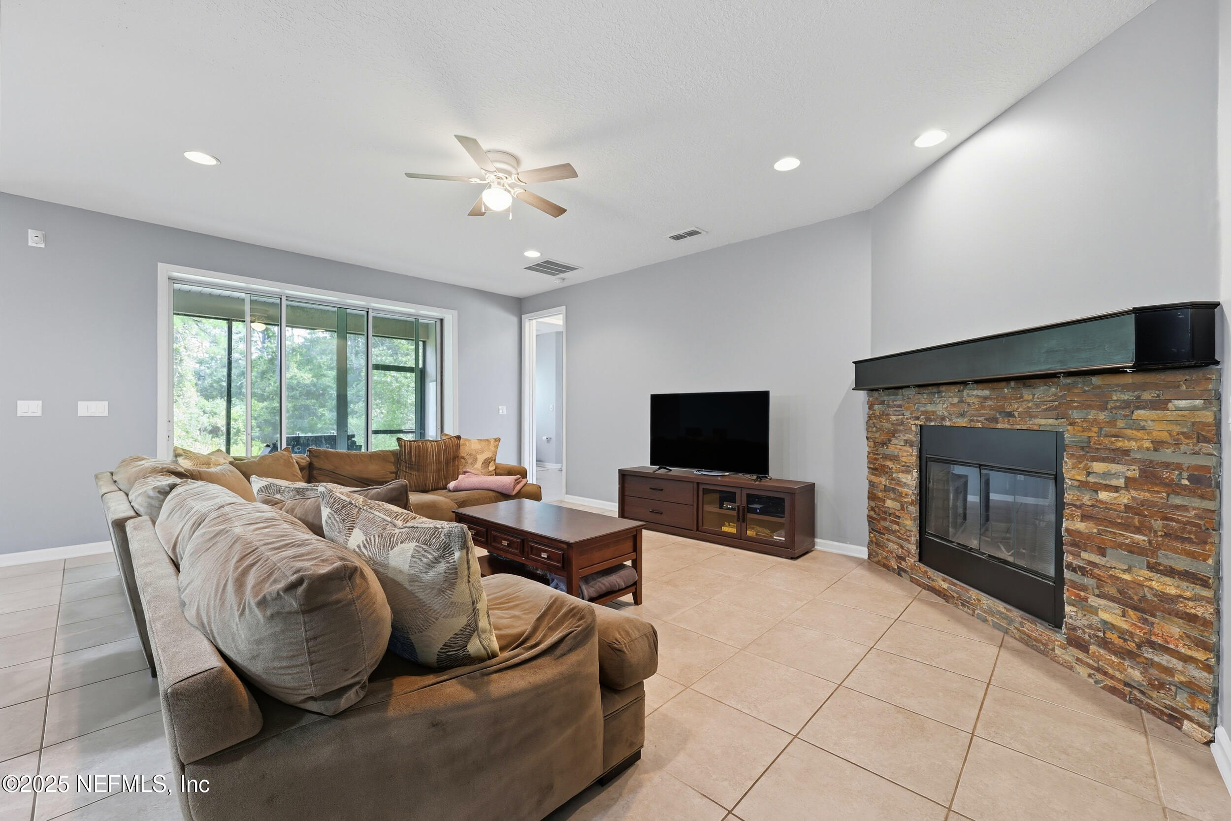 1218 Wetland Ridge Circle Middleburg, FL 32068 - Photo 14 of 75 a living room with furniture and a flat screen tv