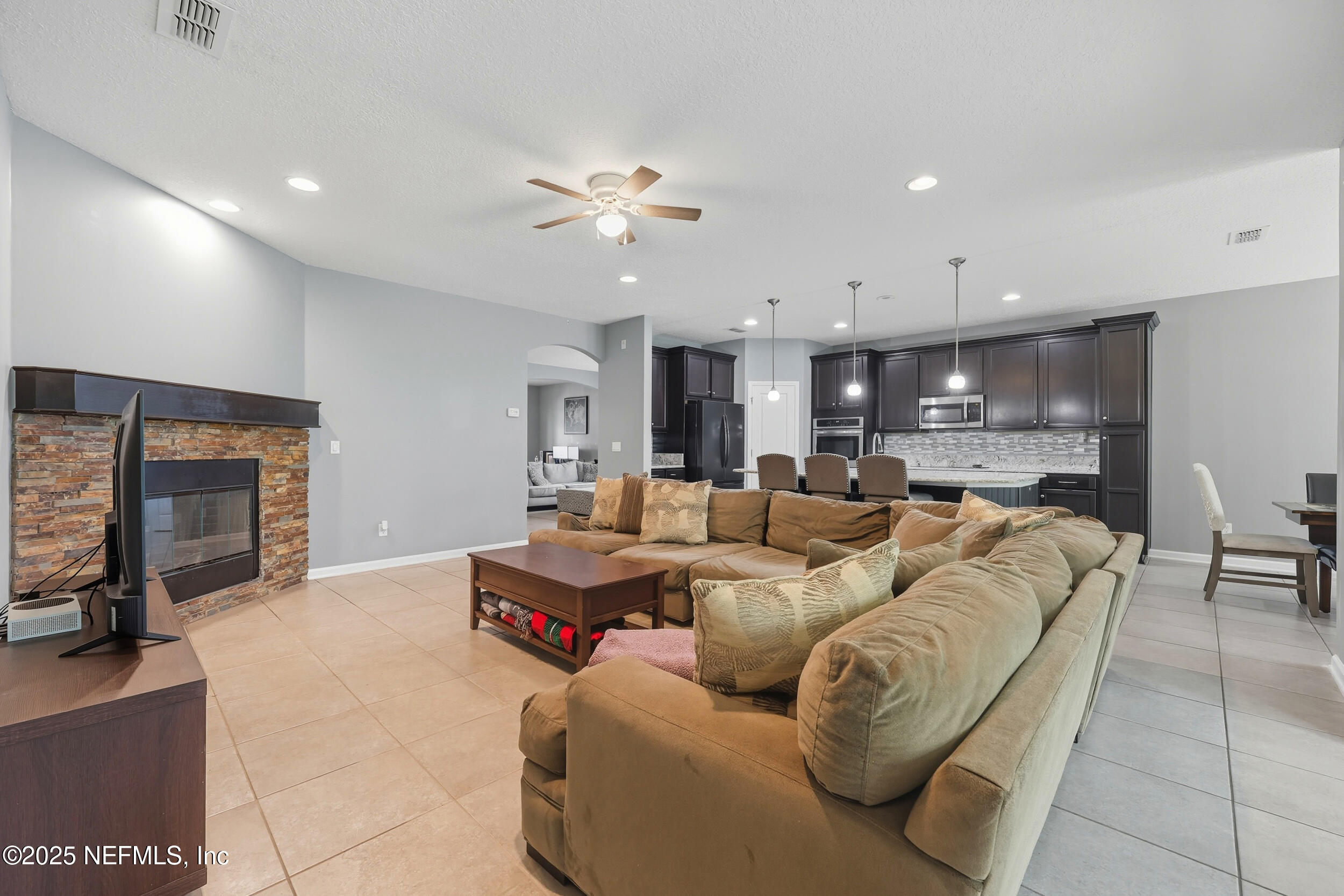 1218 Wetland Ridge Circle Middleburg, FL 32068 - Photo 16 of 75 Living Area to Kitchen & Dining Area