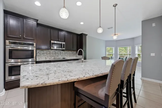 a spacious bedroom with a bed and a cabinets