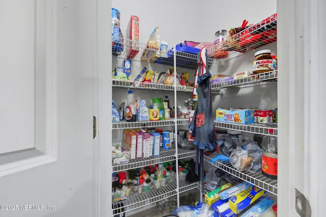 a view of a patio with table and chairs with wooden floor