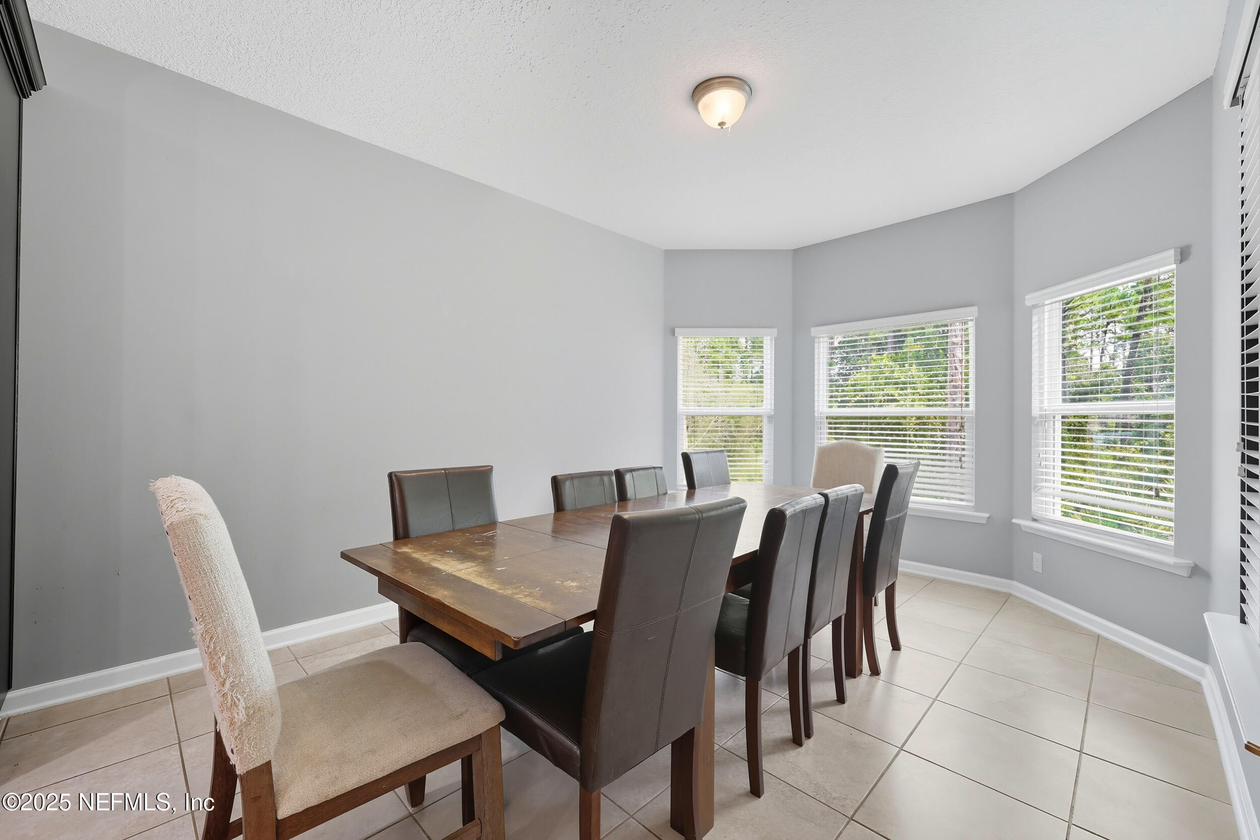 1218 Wetland Ridge Circle Middleburg, FL 32068 - Photo 26 of 75 a view of a dining room with furniture and a window
