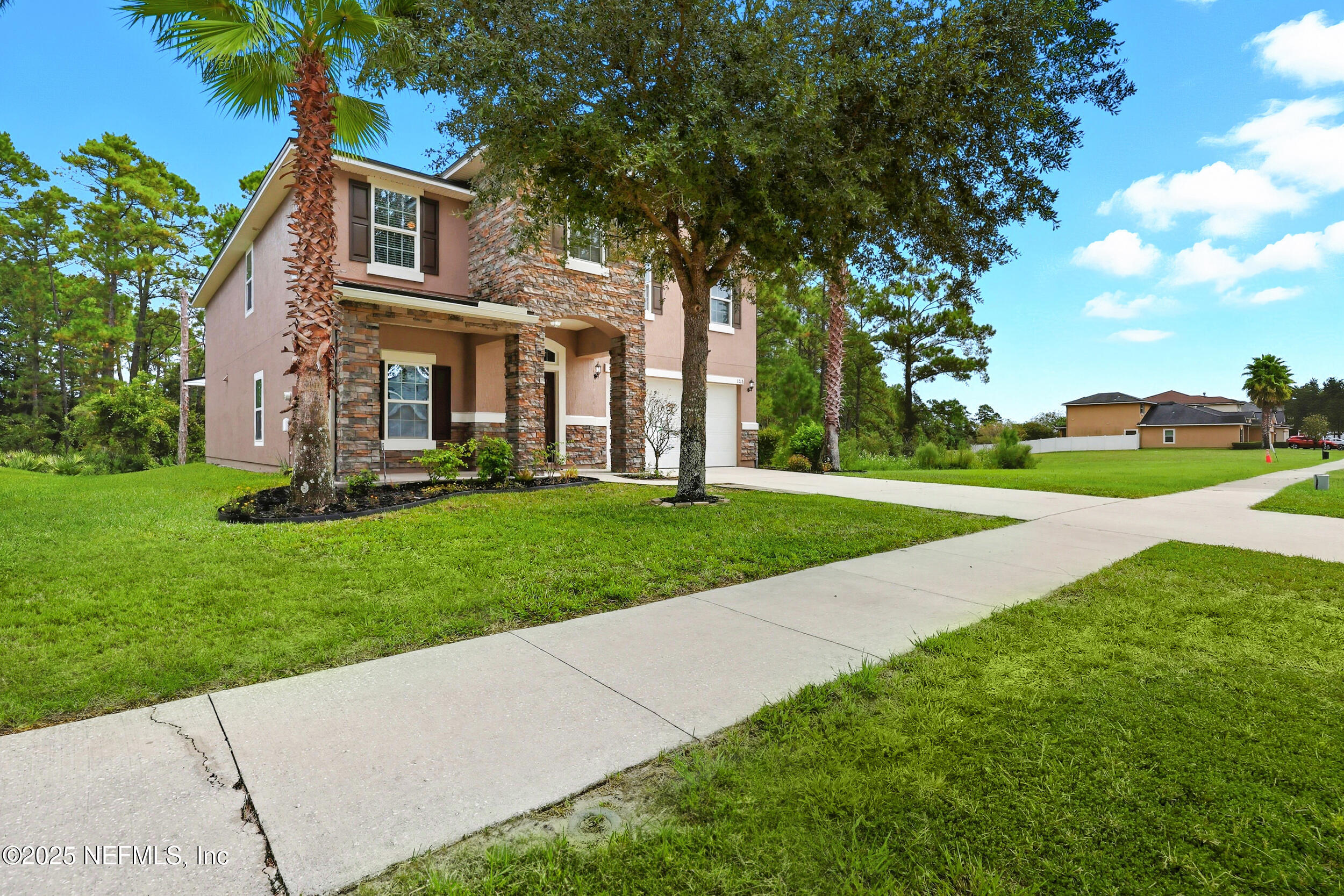 1218 Wetland Ridge Circle Middleburg, FL 32068 - Photo 5 of 75 a front view of a house with a yard