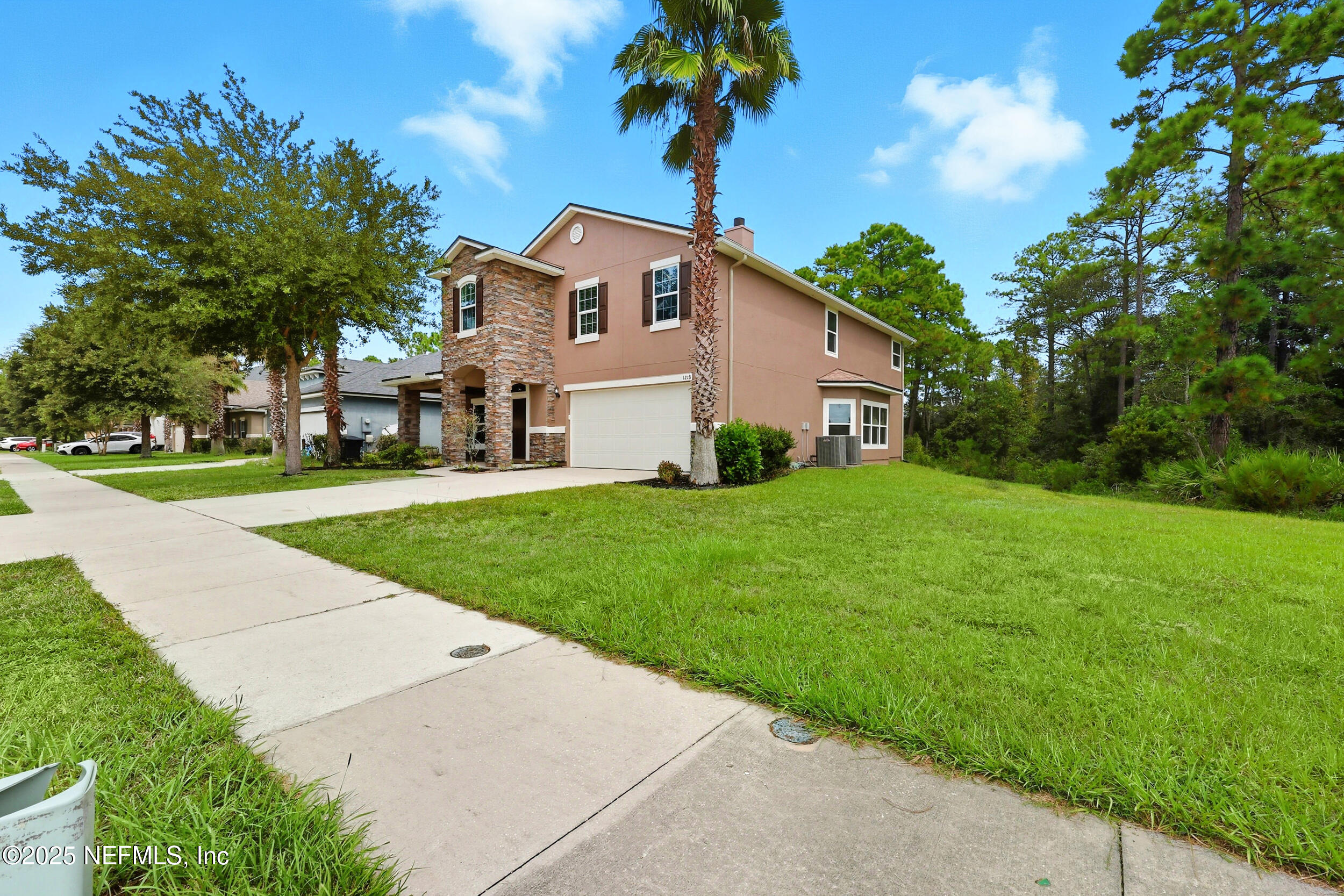 1218 Wetland Ridge Circle Middleburg, FL 32068 - Photo 6 of 75 a front view of a house with garden