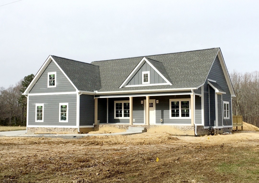 1650 Porter Road Burns, TN 37029 - Photo 1 of 3 a front view of a house with a yard