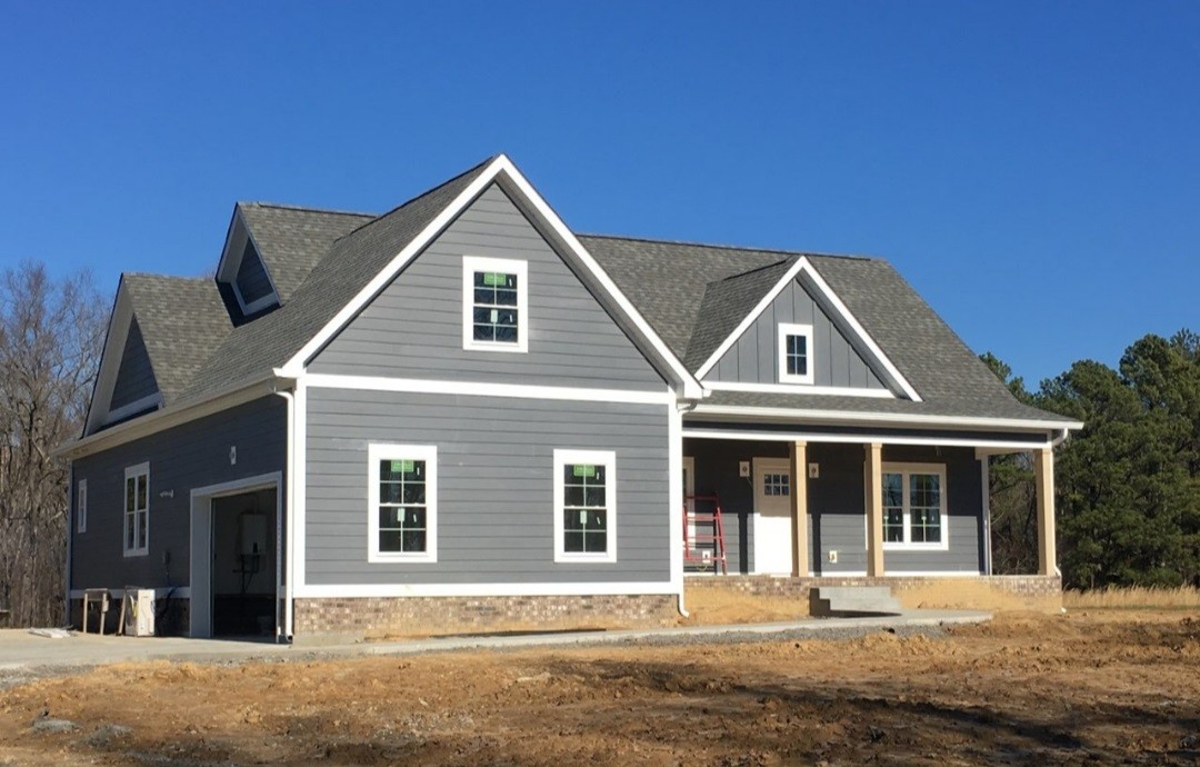 1650 Porter Road Burns, TN 37029 - Photo 2 of 3 a front view of a house with a yard