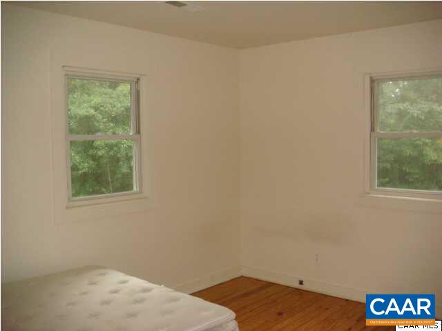 5885 Cub Creek Road Roseland, VA 22967 - Photo 11 of 11 a bedroom with a bed and a window