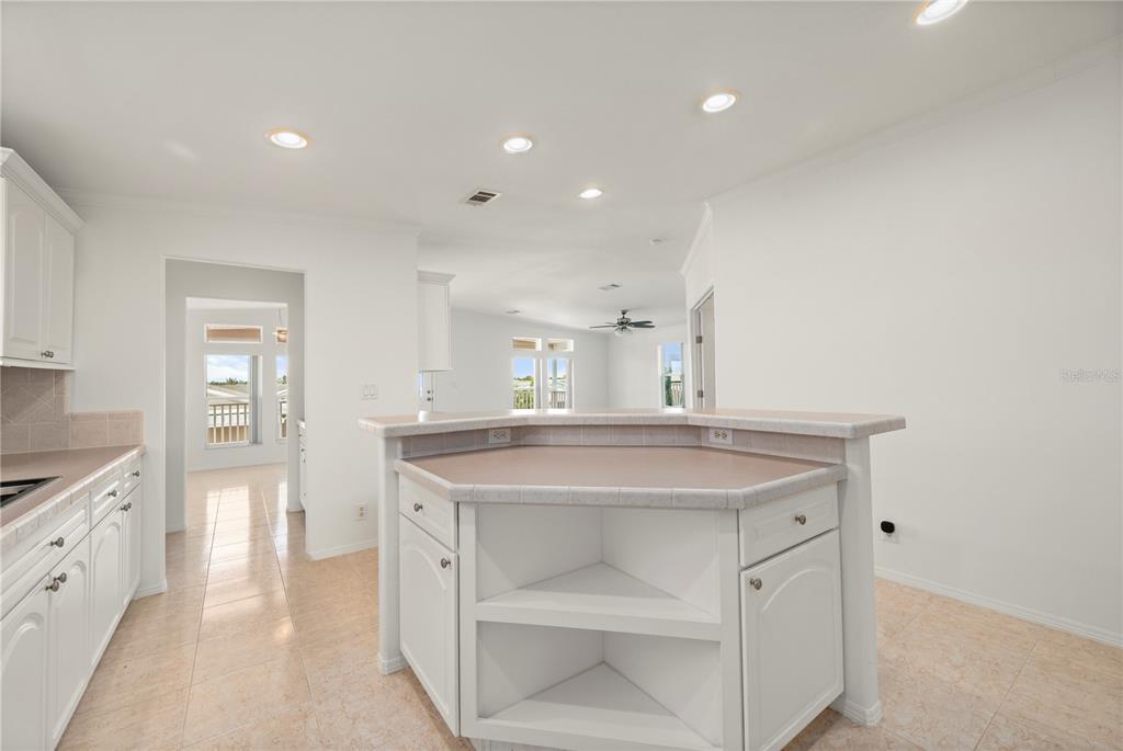 67 Windmill Boulevard Punta Gorda, FL 33950 - Photo 13 of 70 a kitchen with a sink and a refrigerator