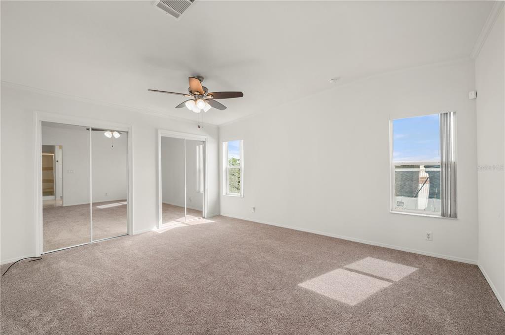 67 Windmill Boulevard Punta Gorda, FL 33950 - Photo 15 of 70 an empty room with fan and windows