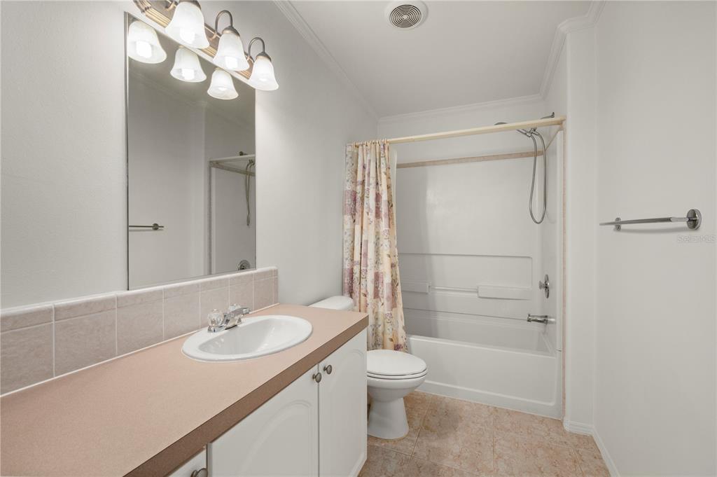 67 Windmill Boulevard Punta Gorda, FL 33950 - Photo 20 of 70 a bathroom with a sink a toilet and shower