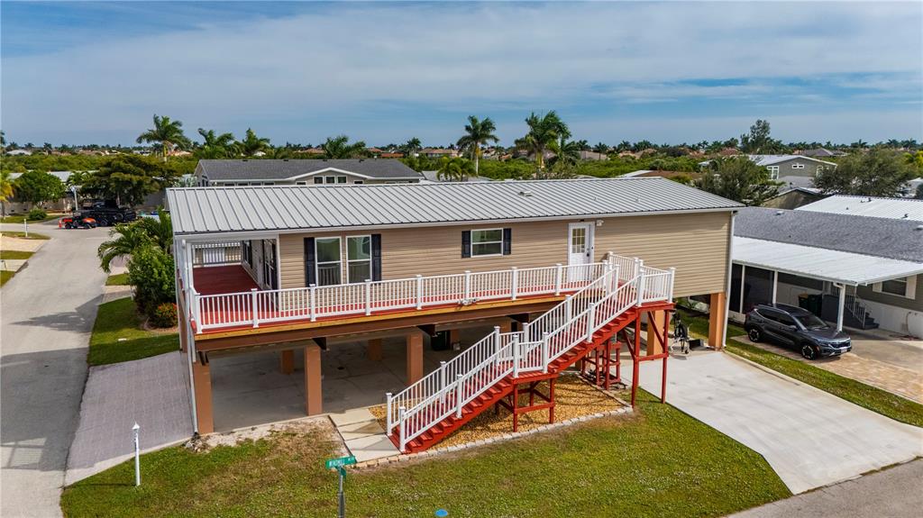 67 Windmill Boulevard Punta Gorda, FL 33950 - Photo 28 of 70 an aerial view of a house with swimming pool and porch
