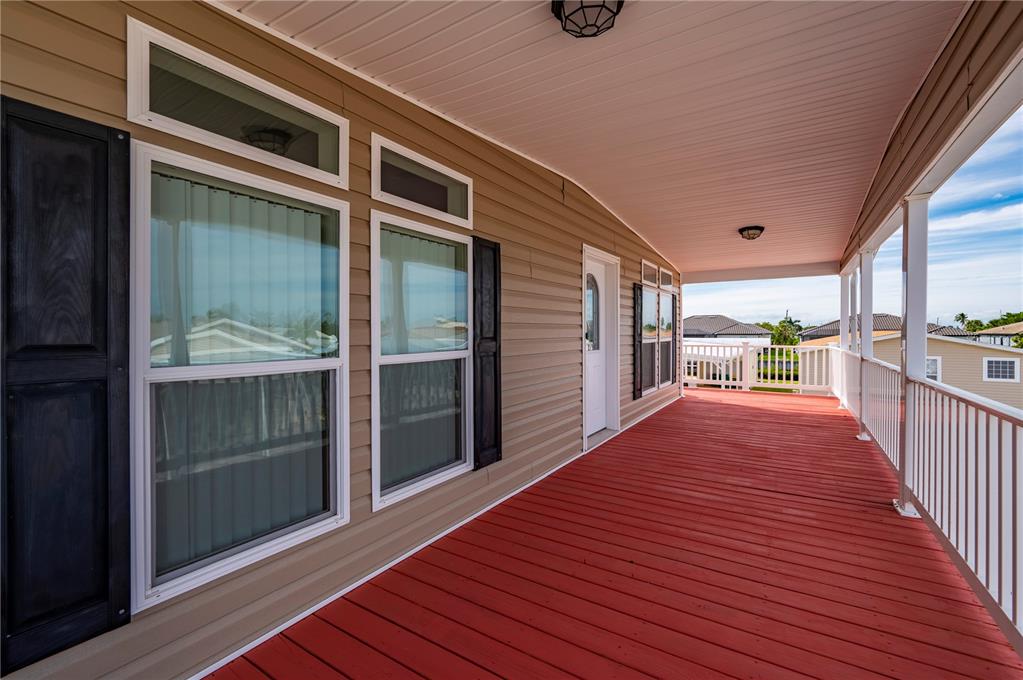 67 Windmill Boulevard Punta Gorda, FL 33950 - Photo 3 of 70 a view of a balcony with wooden floor