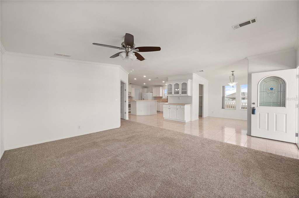 67 Windmill Boulevard Punta Gorda, FL 33950 - Photo 4 of 70 a view of a living room hardwood floor and a ceiling fan