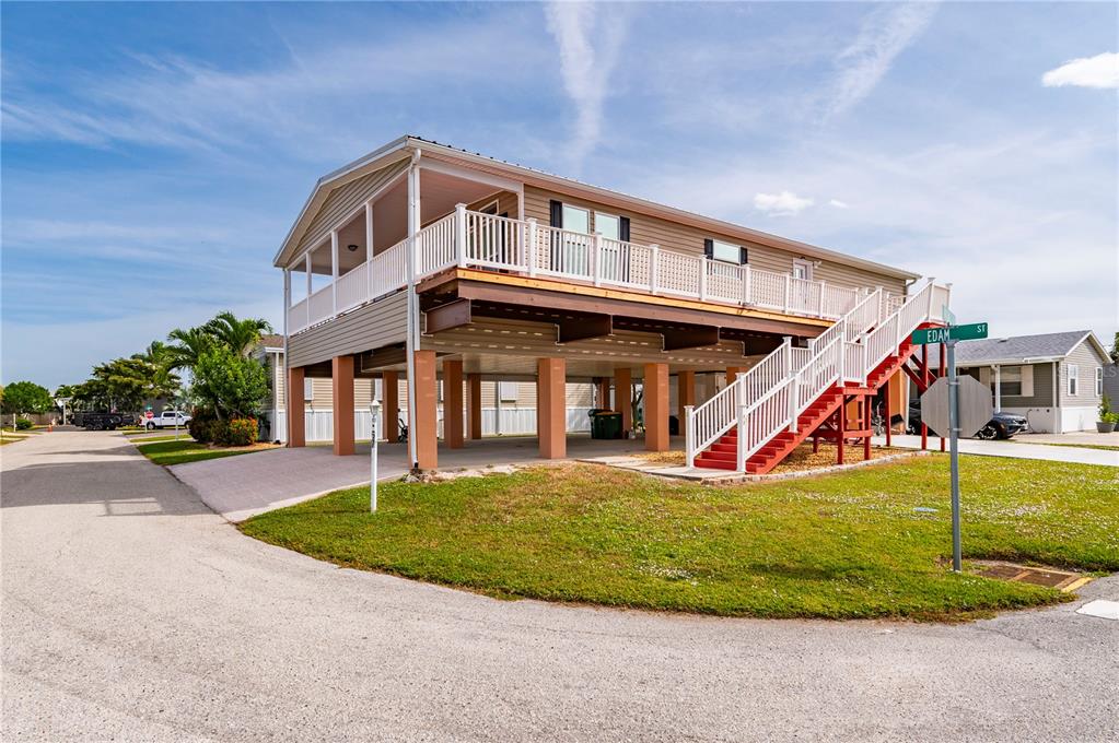 67 Windmill Boulevard Punta Gorda, FL 33950 - Photo 42 of 70 a view of a house with a yard porch and sitting area