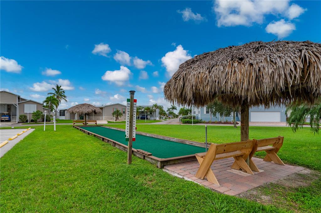 67 Windmill Boulevard Punta Gorda, FL 33950 - Photo 51 of 70 a view of a garden with a slide and a yard