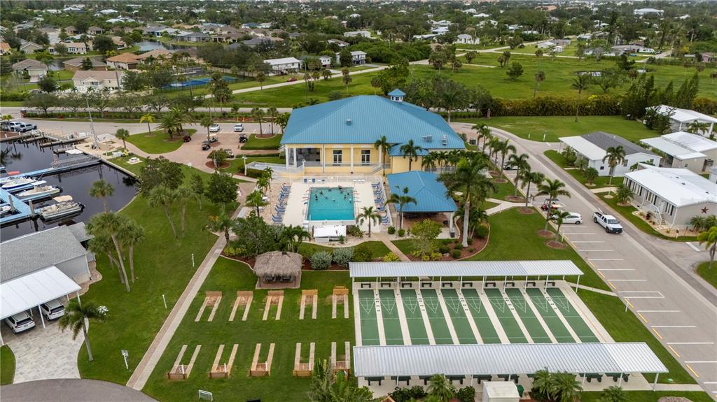 67 Windmill Boulevard Punta Gorda, FL 33950 - Photo 69 of 70 an aerial view of multiple houses with yard