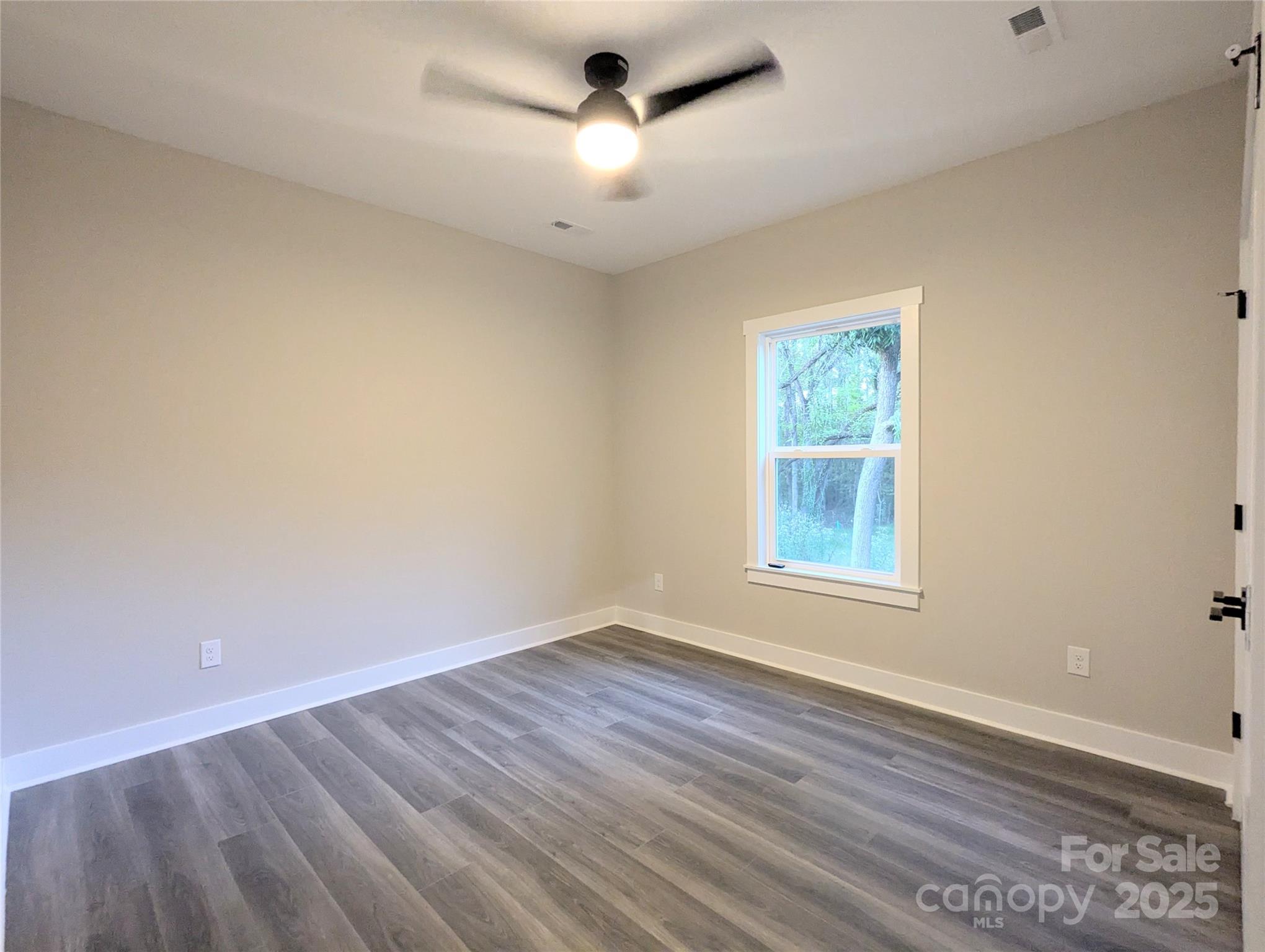 524 Waco Road Kings Mountain, NC 28086 - Photo 16 of 21 wooden floor in an empty room with a window