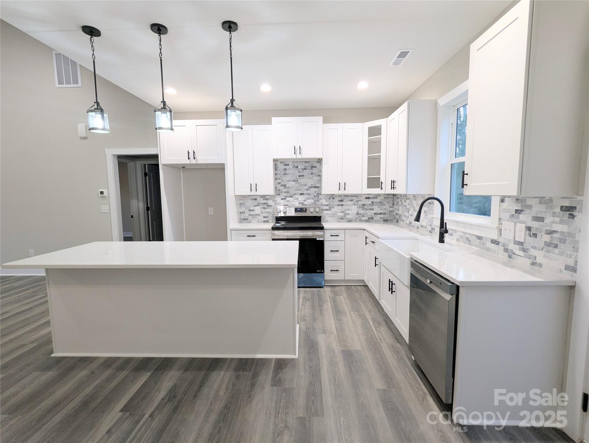 524 Waco Road Kings Mountain, NC 28086 - Photo 5 of 21 a large kitchen with kitchen island a sink stainless steel appliances and cabinets