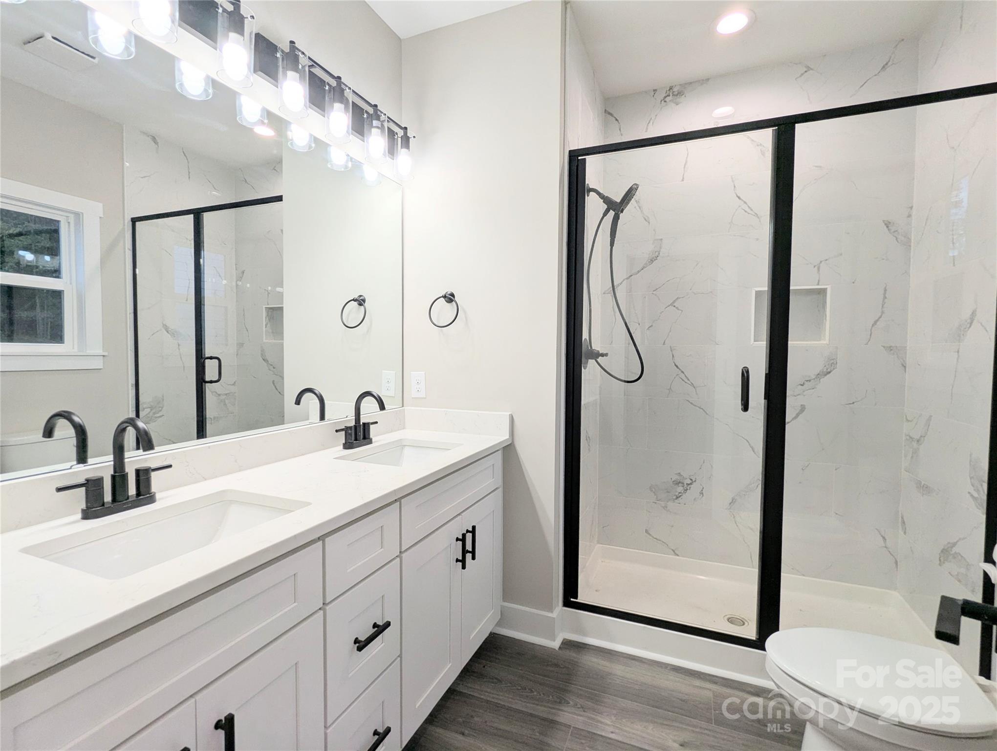 524 Waco Road Kings Mountain, NC 28086 - Photo 10 of 21 a bathroom with a double vanity sink mirror and shower