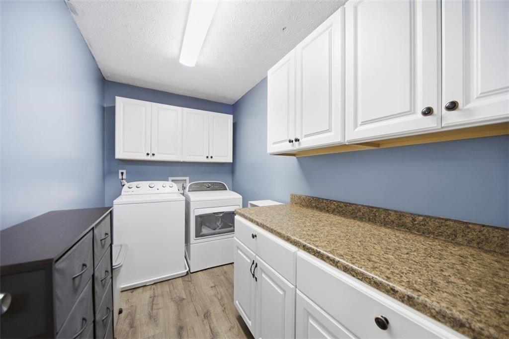 10 Stoneview Circle Covington, GA 30016 - Photo 13 of 25 a utility room with dryer and washer