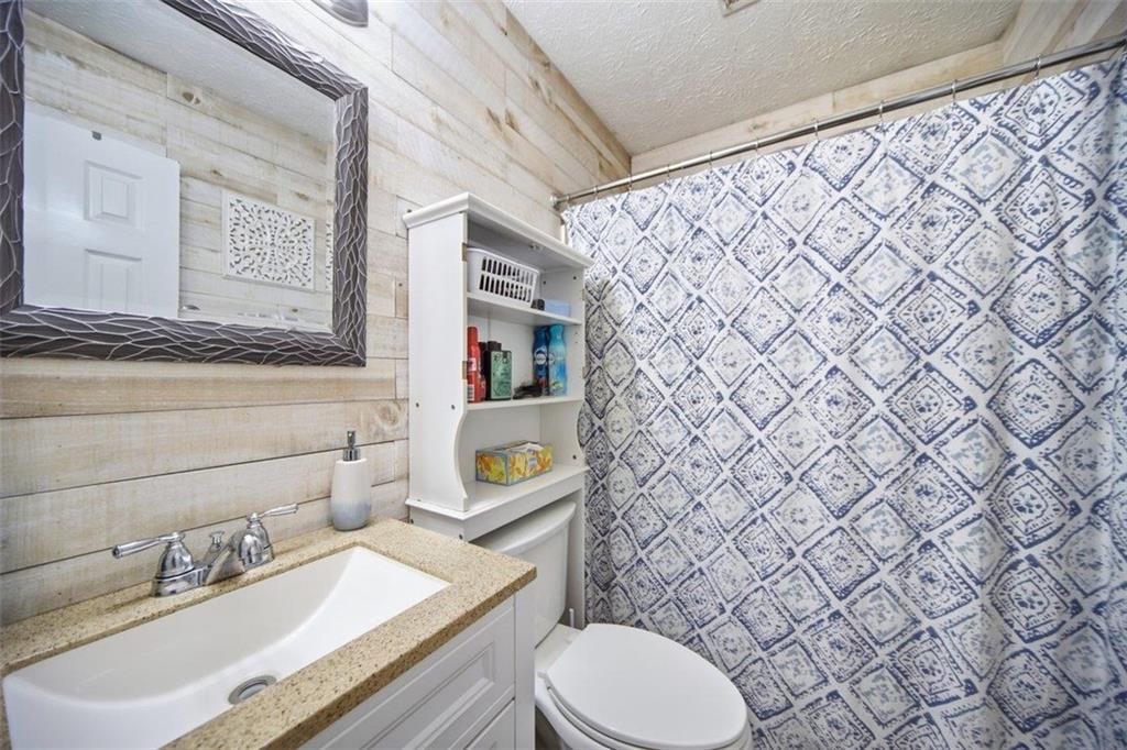 10 Stoneview Circle Covington, GA 30016 - Photo 14 of 25 a bathroom with a sink and a toilet