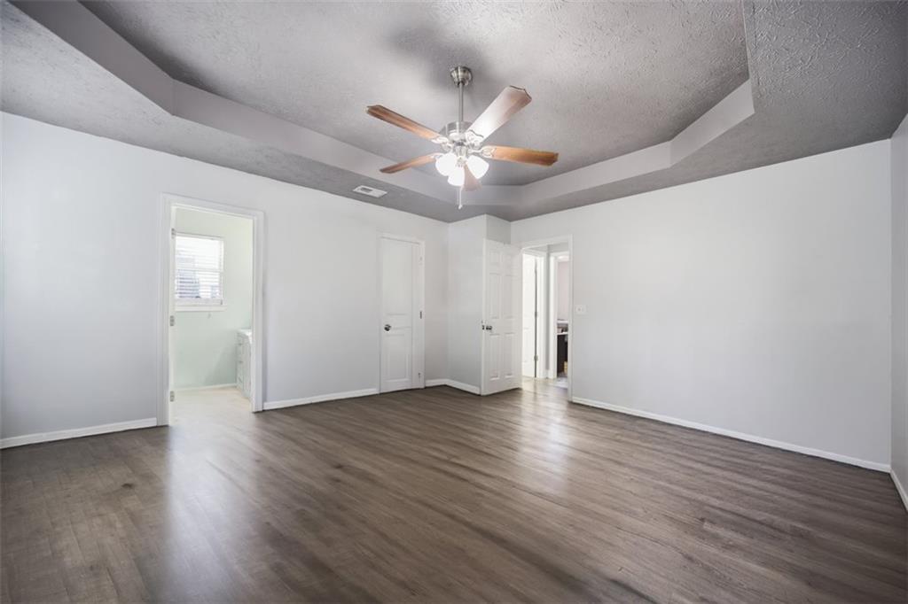 10 Stoneview Circle Covington, GA 30016 - Photo 20 of 25 a view of an empty room with wooden floor