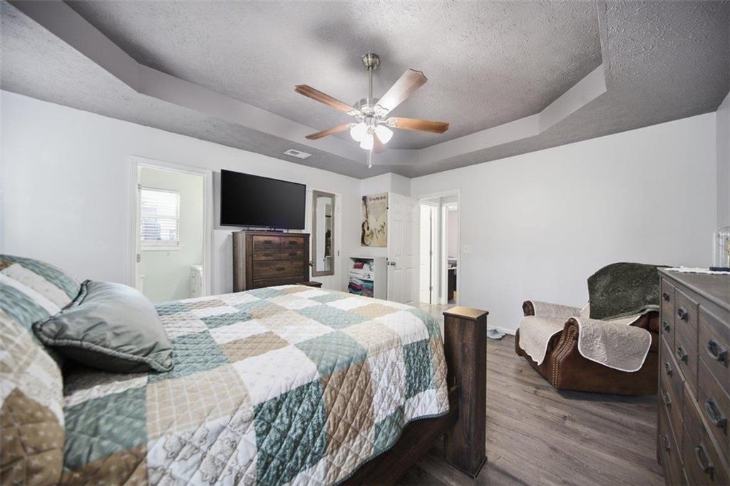 10 Stoneview Circle Covington, GA 30016 - Photo 21 of 25 a bedroom with a bed and furniture