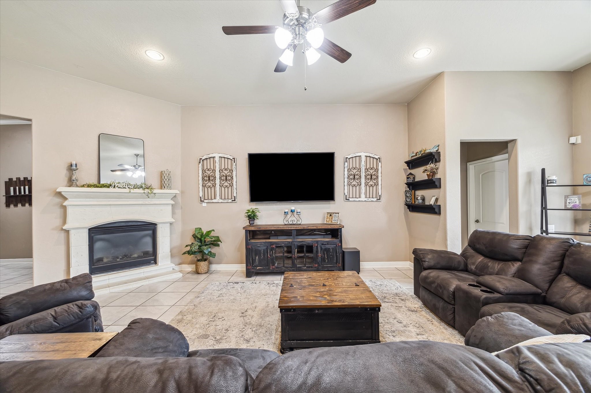 4914 Mountain Maple Trail Rosenberg, TX 77471 - Photo 8 of 24 Generously sized living room featuring a cozy corner fireplace ideal for relaxing evenings and holiday gatherings.
